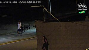 Amateur couple gets caught by beach security camera during outdoor public flashing with big tits voyeur action