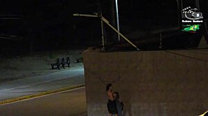 Amateur couple gets caught by beach security camera during outdoor public flashing with big tits voyeur action