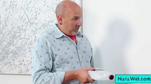 Sexy blonde Lilly Bell pours nuru gel on her naked body and rubs natural tits on client Codey Steele during massage