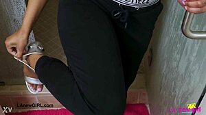 Stunning bronze skin model takes a refreshing shower in the bathroom