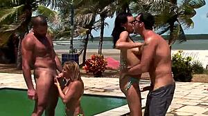 Steamy anal encounter by the pool featuring two passionate couples in double penetration