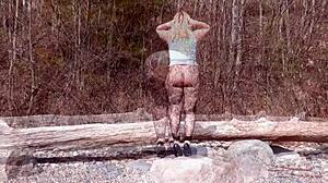 Fishnet pantyhose on big ass blonde babe in forest with natural tits and fetish legs exposed