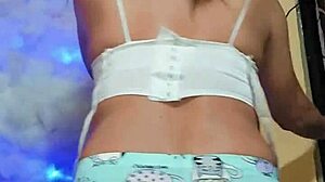 In a cozy setting, the transsexual in pajamas gets ready for some intense masturbation session.