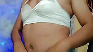 In a cozy setting, the transsexual in pajamas gets ready for some intense masturbation session.