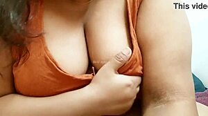 suggestive tamil aunty showing off her big boobs