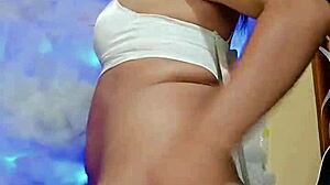 In a cozy setting, the transsexual in pajamas gets ready for some intense masturbation session.