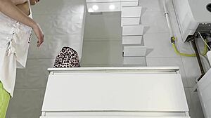 Hot brunette college girl in mini tennis skirt and knee socks shows panties in bathroom