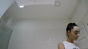 Hot brunette college girl in mini tennis skirt and knee socks shows panties in bathroom