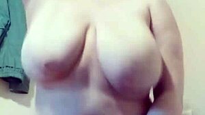 Oiled up riding session features bouncing tits on dildo with natural curves.