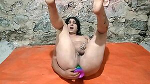 Oh yeah, this ts is having fun stretching with a big dildo in her ass.