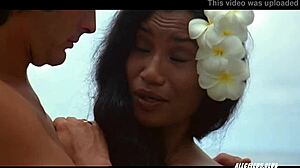 dialogic: manuia taie shows off her small tits and gives a handjob with banana in this retro celebrity nude scene