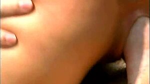 a mature man fucks an exotic babe wearing only a cap and sunglasses on the seaside stones