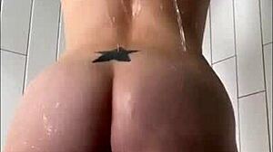 Shower masturbation session features pretty milf with big clit natural tits getting wet in bathing tattoo scene