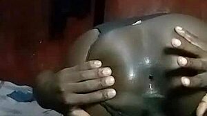 Hey, watch this horny Kenyan crossdresser strip and finger his gaping asshole solo.