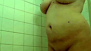 Intense shower play unfolds with dominant mommy in control