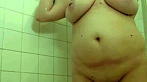 Intense shower play unfolds with dominant mommy in control