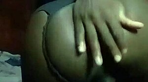 Hey, watch this horny Kenyan crossdresser strip and finger his gaping asshole solo.