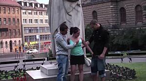 This cute teen 18+ girl gets fucked by 2 guys in public right by the famous statue 😲