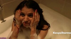Hey, check out this Indian housewife taking a steamy shower, her big tits and ass all wet and soapy.