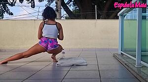 brunette working out outside with shorts wedged in her ass