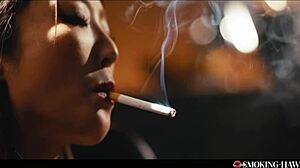 Hey, check out this Japanese girl doing dirty talk while smoking and blowing on a thick cock