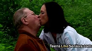 an old guy takes a brunette teen with big tits outdoors bending her over for doggystyle pounding and kissing