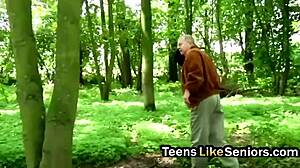 an old guy takes a brunette teen with big tits outdoors bending her over for doggystyle pounding and kissing