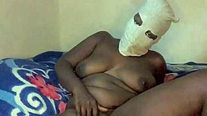 Hey, check out this sexy ebony babe dancing totally naked with tattoos