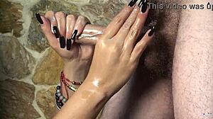 colombian curvy latina with long hair gives oiled handjob massage leading to huge cumshot dripping from black nails