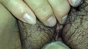 Porn in Chinese features Asian model masturbating with penis in close-up action.