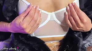 Brunette in fur coat and pantyhose uses vibrator on pussy for squirting close-up