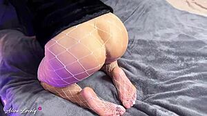 Brunette in fur coat and pantyhose uses vibrator on pussy for squirting close-up