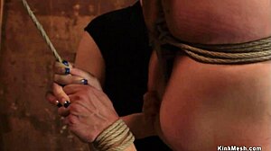 redhead endures suspensions with bondage and choking from lezdom using dildo and gagging