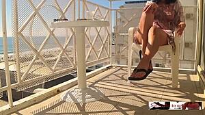 Did you see that hidden cam catch the sexy girl masturbating on the hotel balcony by the crowded beach?