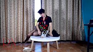 Who knew this seductive lady in pantyhose and heels would striptease so wildly on that round table!