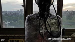 Asian In Bondage With 1mm Rubber Mask And Catsuit Bound Outdoors In Latex Fetish Scene