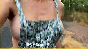 Wife dares to flash big tits with sideboob while running nude in public outdoor spot.