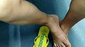 The candid Brazilian girl engages in playful shoeplay with her flip flops in a hidden spot