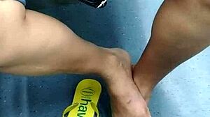 The candid Brazilian girl engages in playful shoeplay with her flip flops in a hidden spot