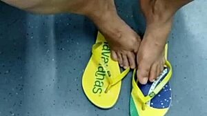 The candid Brazilian girl engages in playful shoeplay with her flip flops in a hidden spot