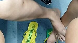 The candid Brazilian girl engages in playful shoeplay with her flip flops in a hidden spot