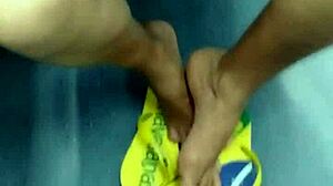 The candid Brazilian girl engages in playful shoeplay with her flip flops in a hidden spot