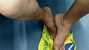 The candid Brazilian girl engages in playful shoeplay with her flip flops in a hidden spot