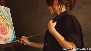 Oh wow, check out this redhead babe stripping and painting her perfect shaved pussy!