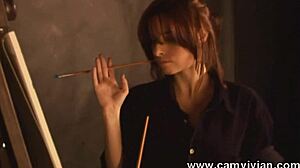 Oh wow, check out this redhead babe stripping and painting her perfect shaved pussy!