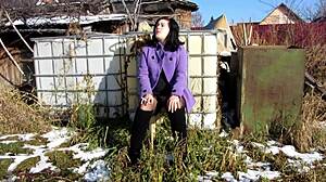 Look at this cute milf smoking a cigarette outdoors. She's showing her shaved pussy with dildo inside and tits in public fetish style.