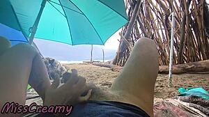 Misscreamy grips my cock for intense handjob during stormy public beach sex in 4k