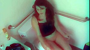 Isn't this horny brunette slut wild toying her big tits in public toilet?