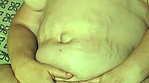 She teases her pussy with a dildo until she cums hard in the bedroom