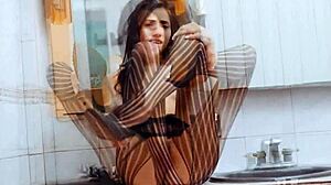 sofia torres poses elegantly in her stylish fishnet outfit